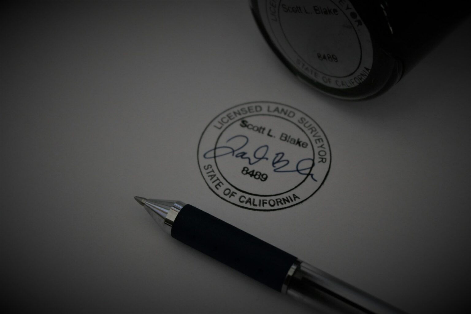 a pen sitting on top of a piece of paper