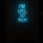 a neon sign that says i'm like so rich