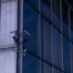 a security camera attached to the side of a building