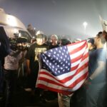 man holding American flag
