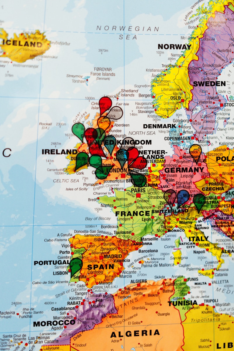 Europe map marked with colorful push pins.