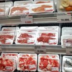 A display case filled with lots of different types of meat
