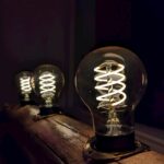 a light bulb sitting on top of a wooden table